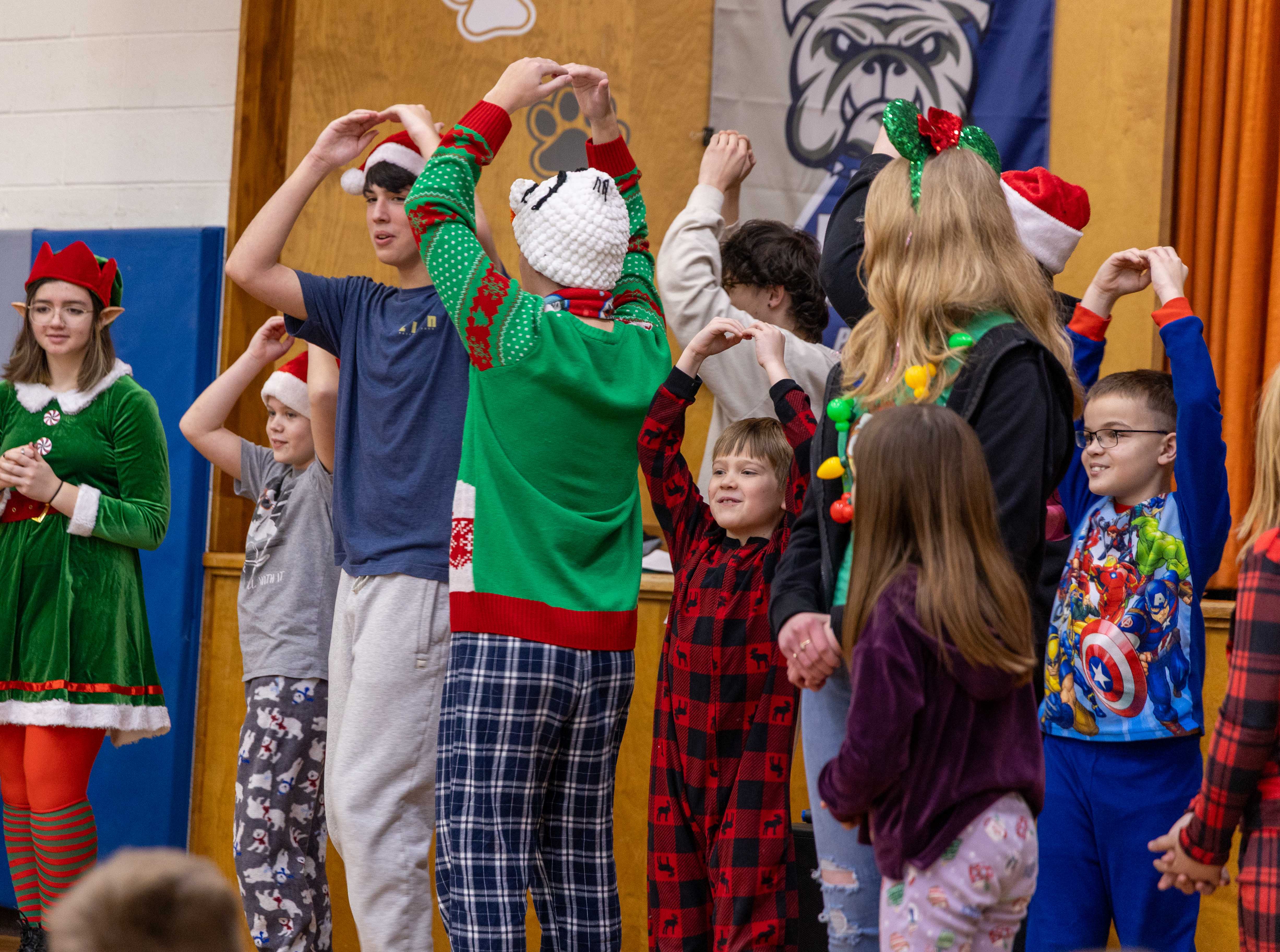 Radez and HS students twirl together during a group sing-a-long of Twelve Days of Christmas